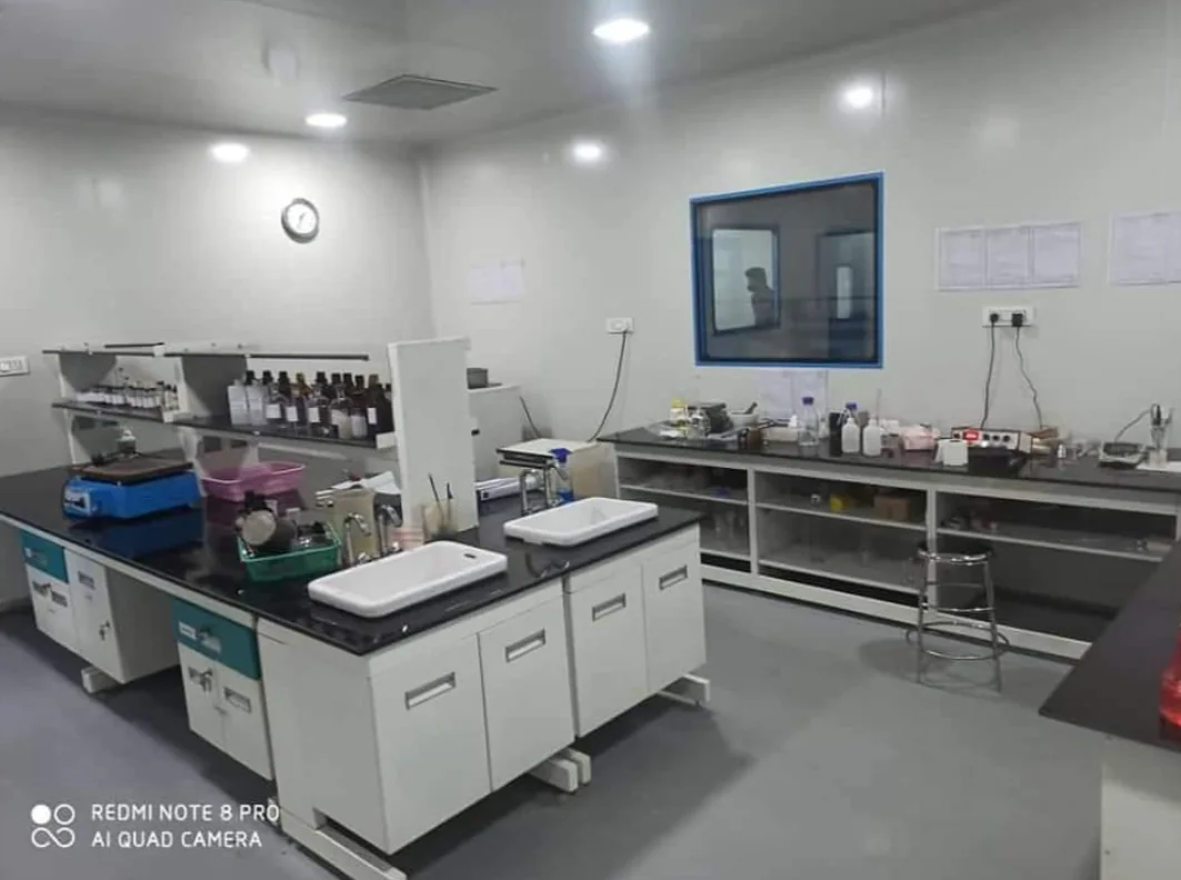 Industrial testing laboratory with workbenches and equipment